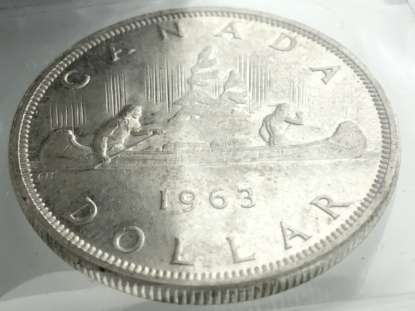 .600 ozt 1963 Voyageur MS-65 $1