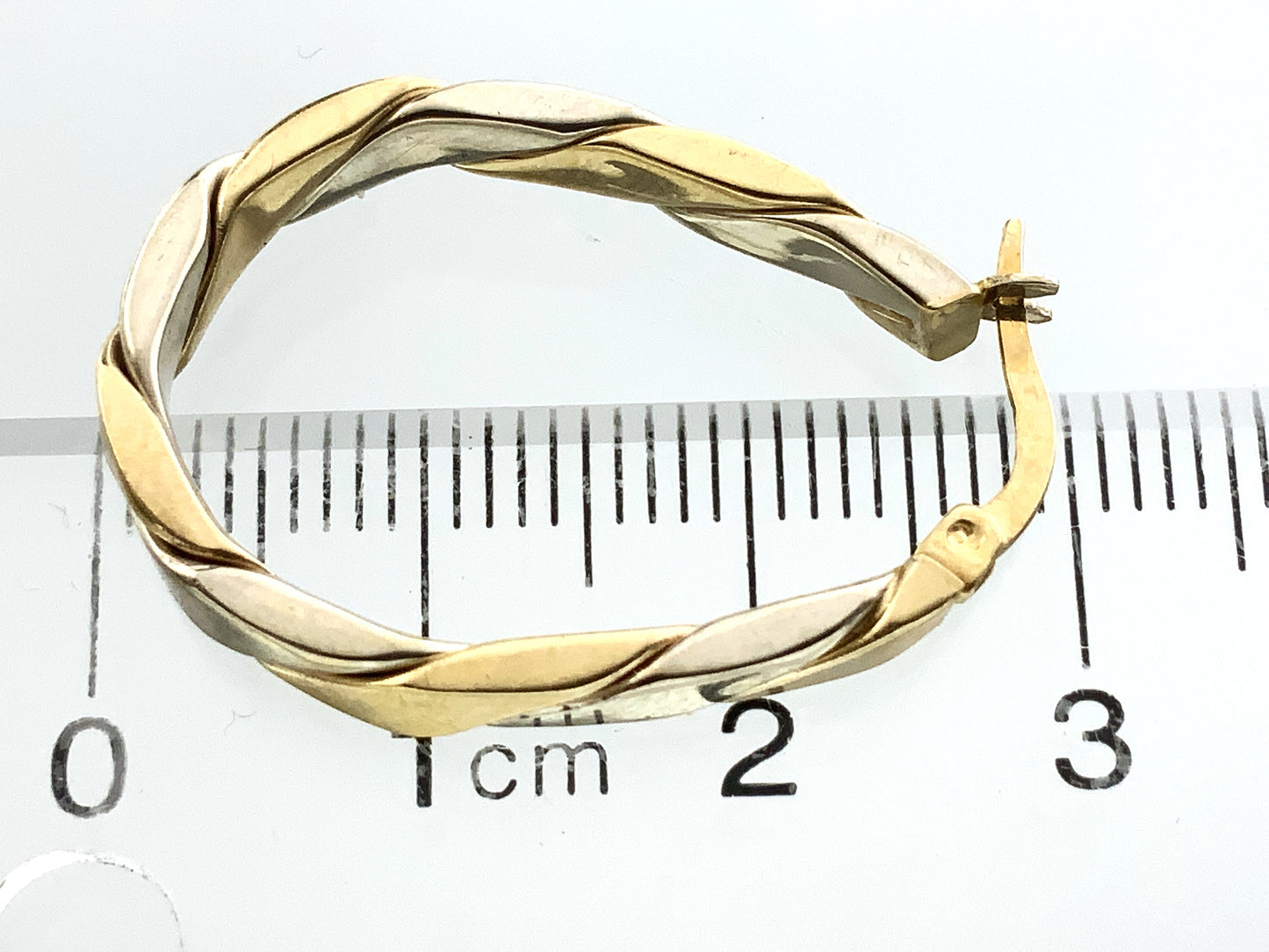 10K Yellow and White Gold Two Toned Twisted Oval Hoop Earrings AU350