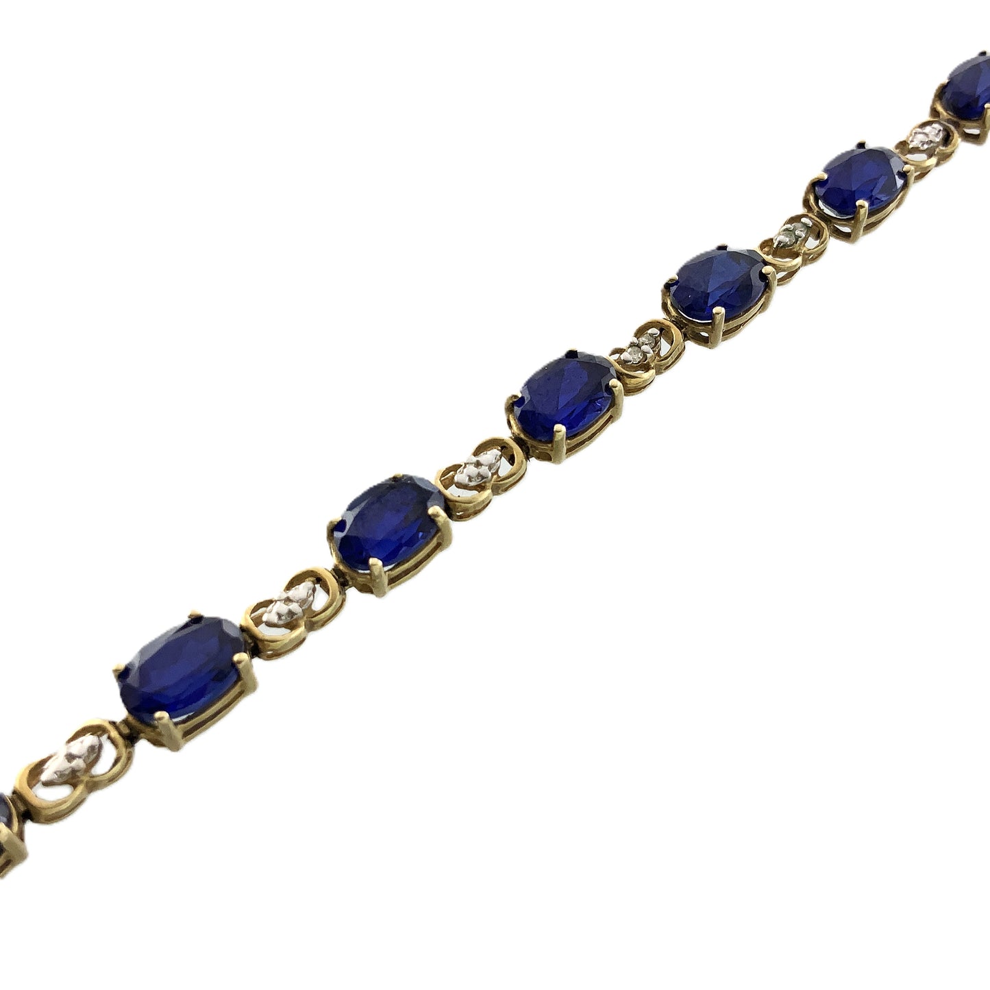 10K Yellow Gold Oval Blue Sapphires 7in x 5.1mm Bracelet AU386