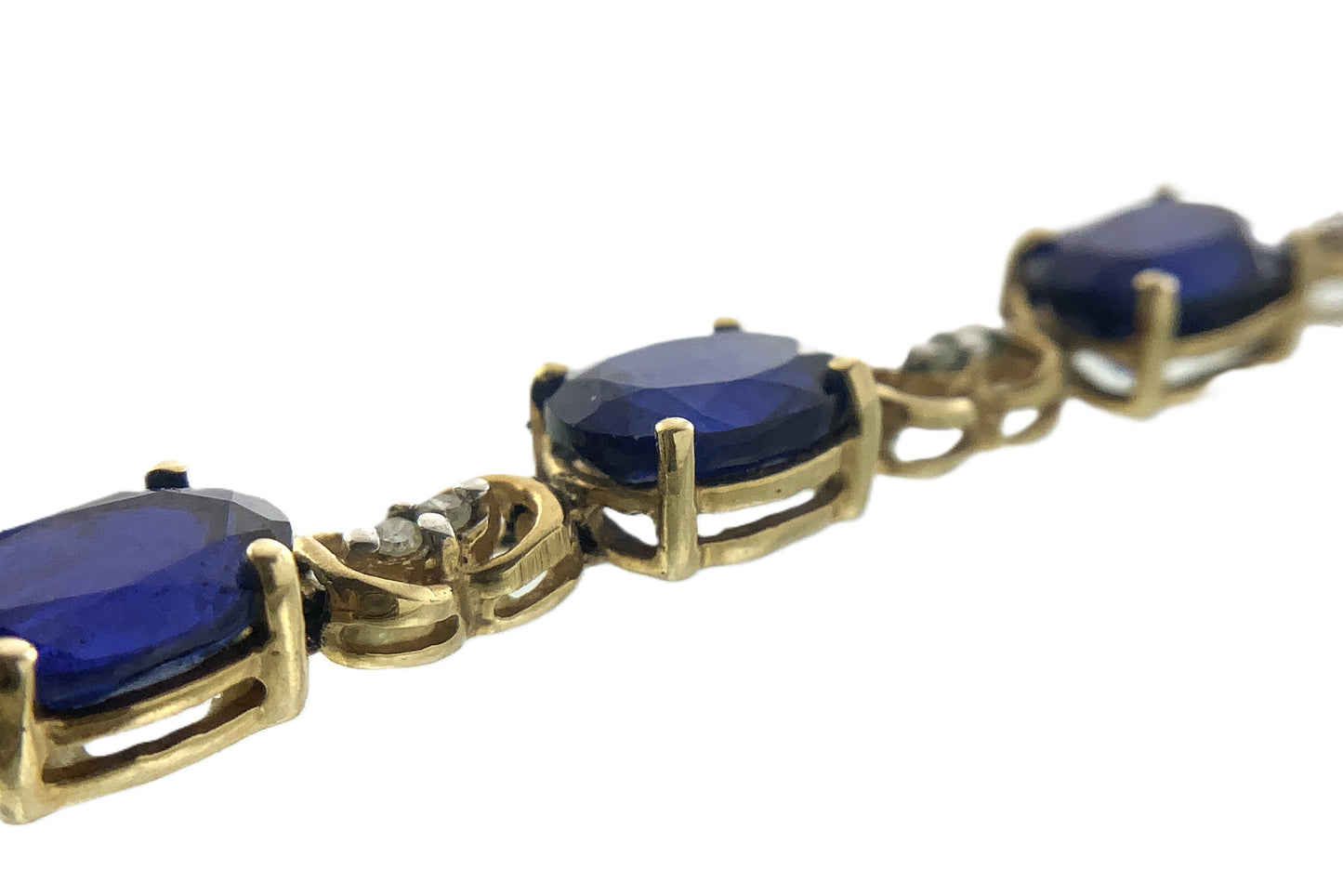 10K Yellow Gold Oval Blue Sapphires 7in x 5.1mm Bracelet AU386