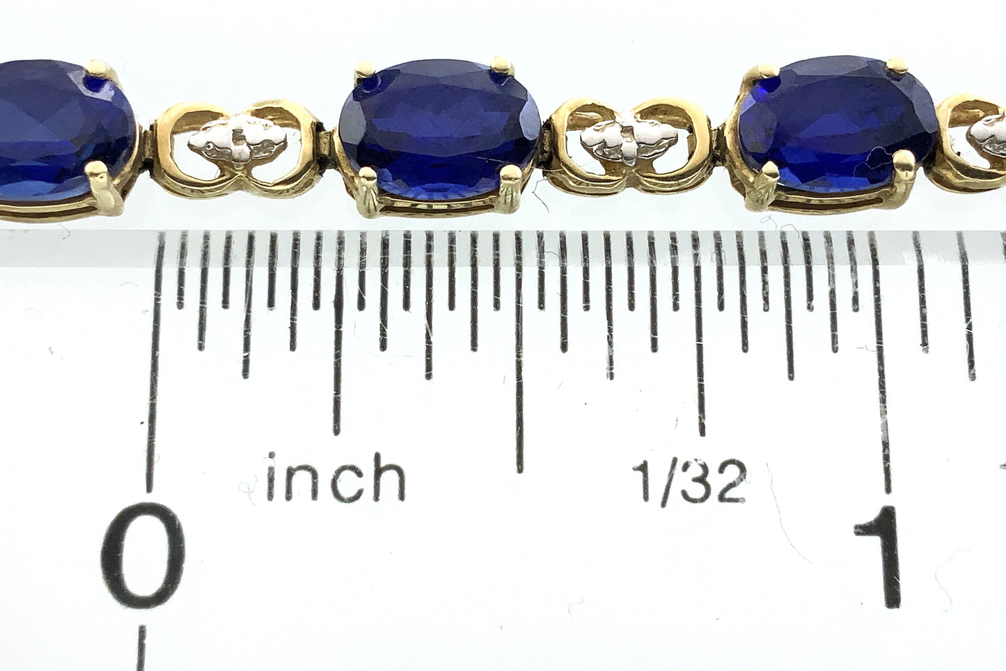 10K Yellow Gold Oval Blue Sapphires 7in x 5.1mm Bracelet AU386
