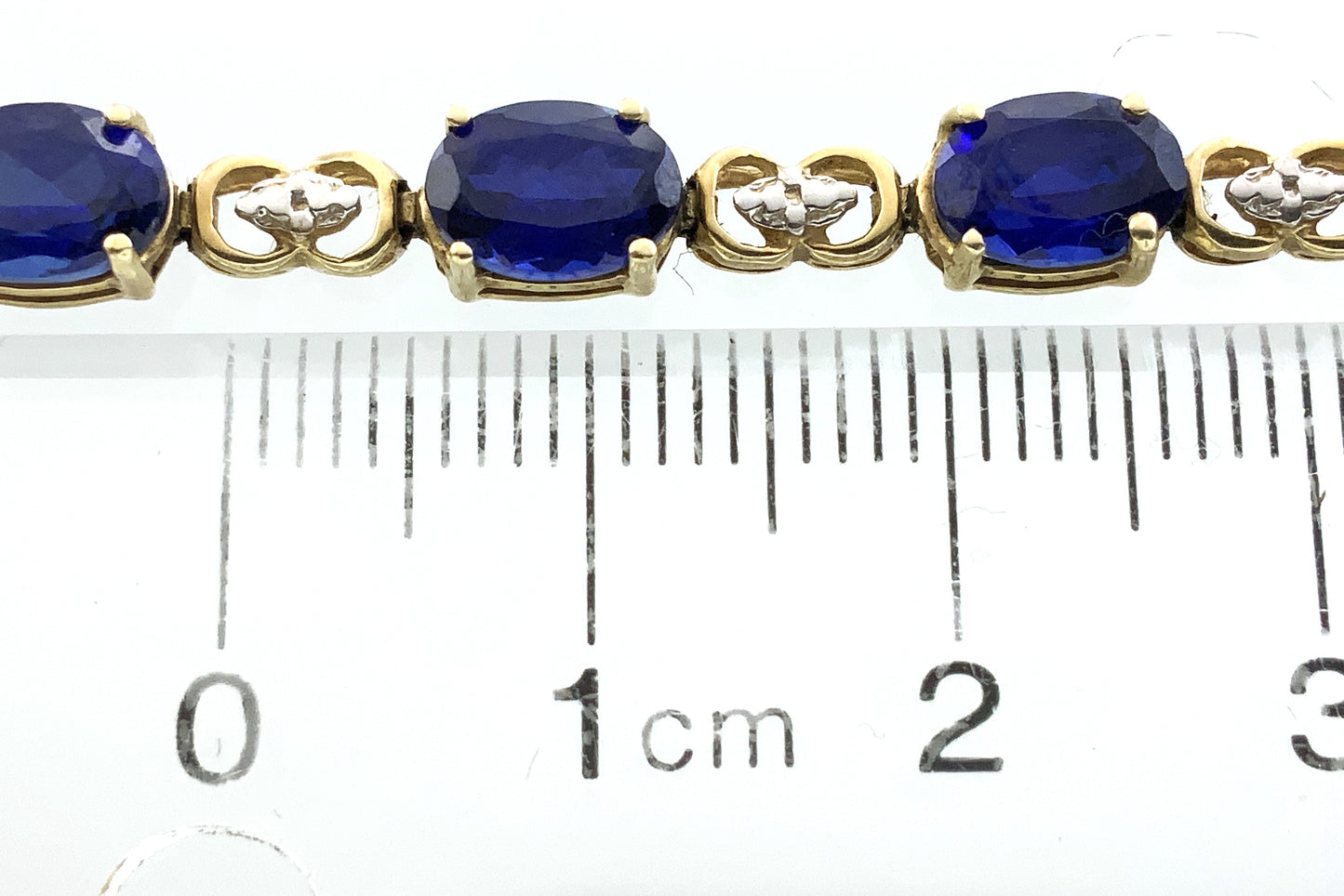 10K Yellow Gold Oval Blue Sapphires 7in x 5.1mm Bracelet AU386