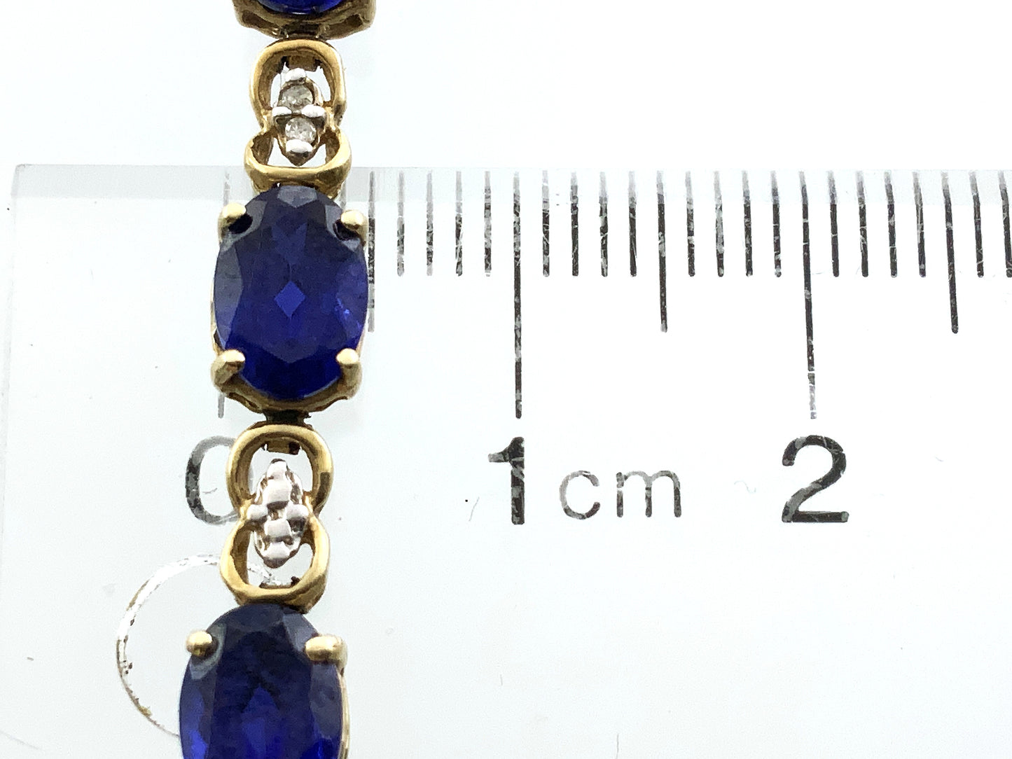 10K Yellow Gold Oval Blue Sapphires 7in x 5.1mm Bracelet AU386