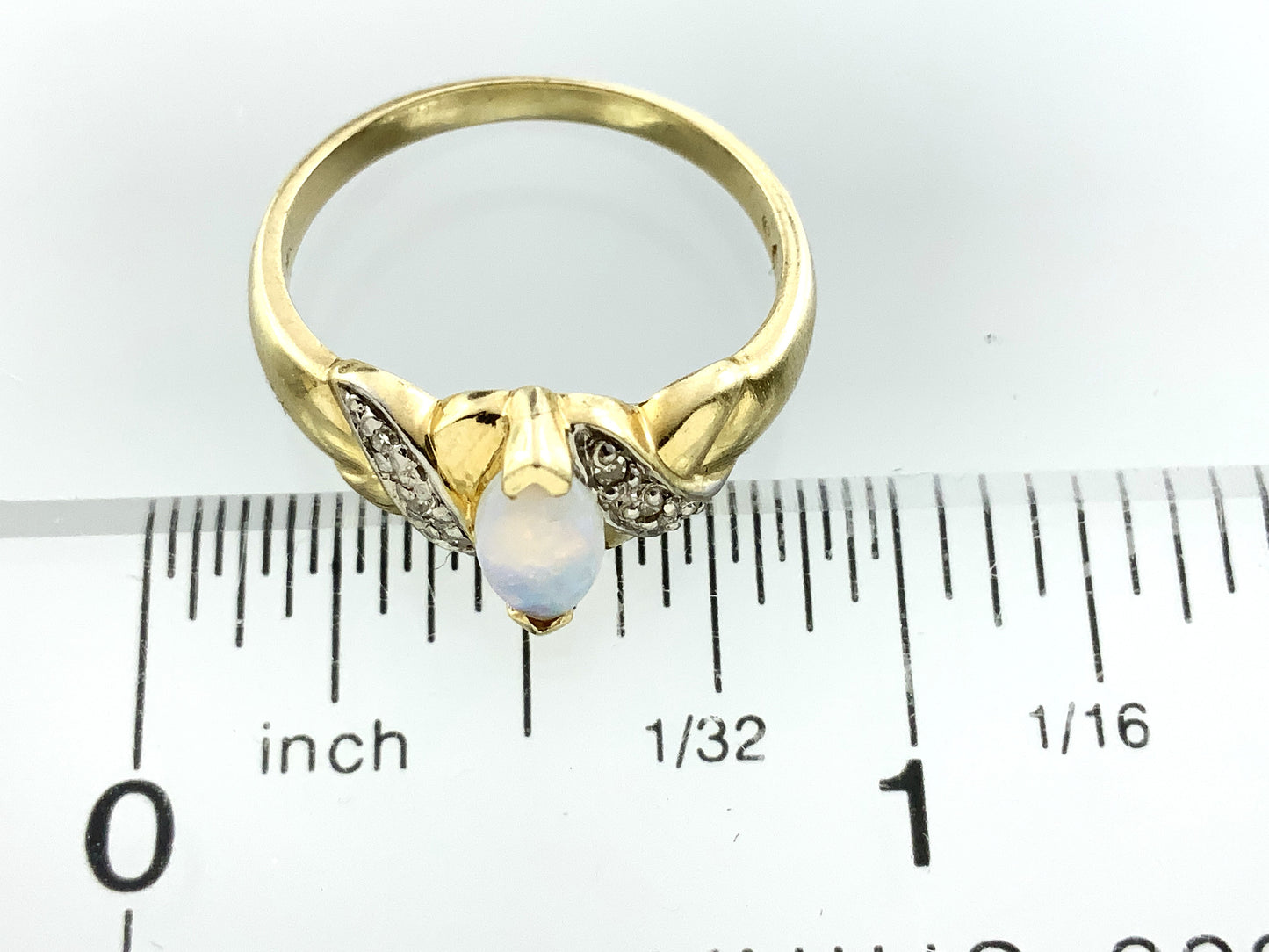 10K Yellow Gold Marquise Cut Opal with Diamond Twisted Bypass Accents .06 Total Carats Size 6 Ring AU418