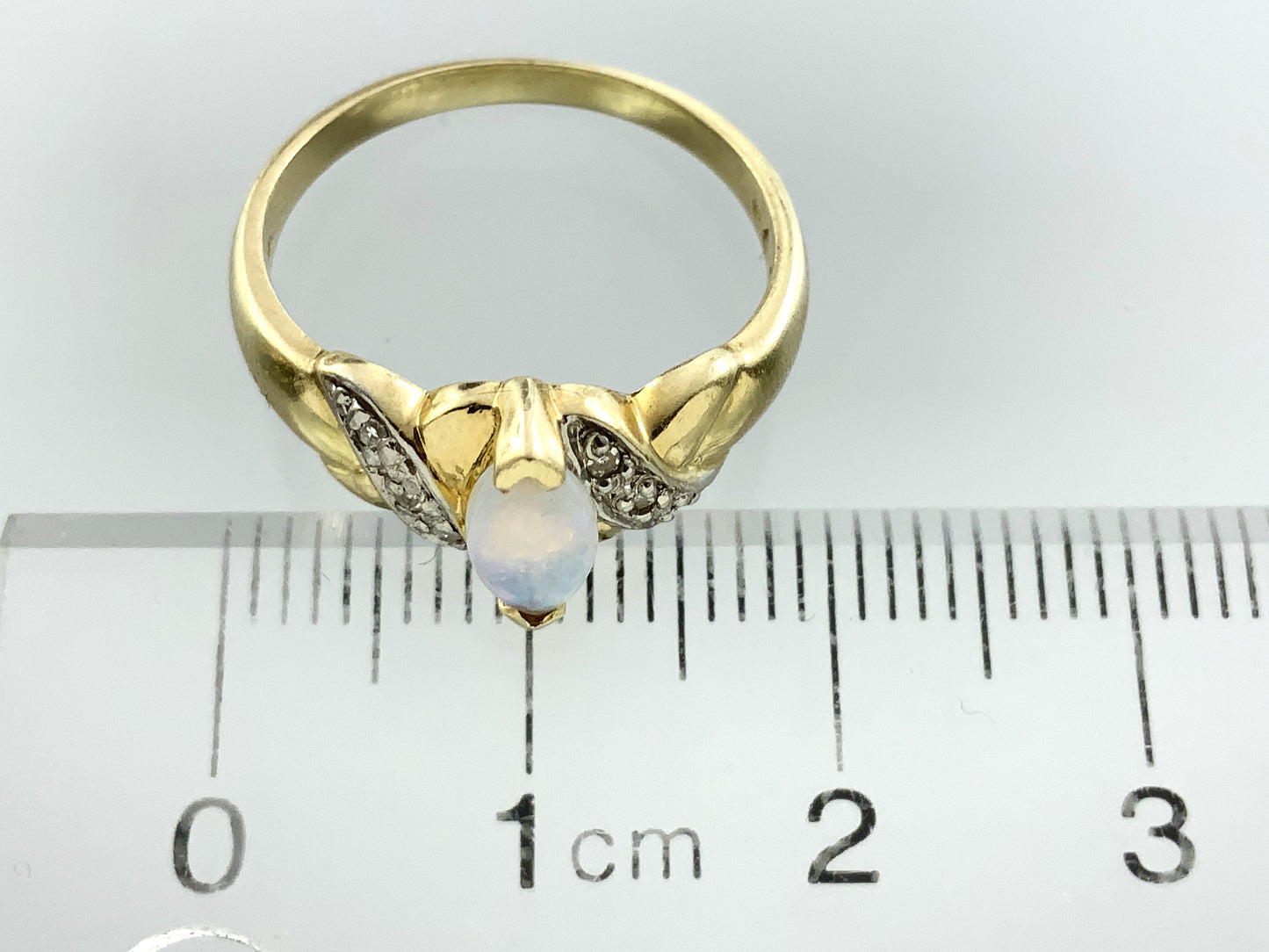 10K Yellow Gold Marquise Cut Opal with Diamond Twisted Bypass Accents .06 Total Carats Size 6 Ring AU418