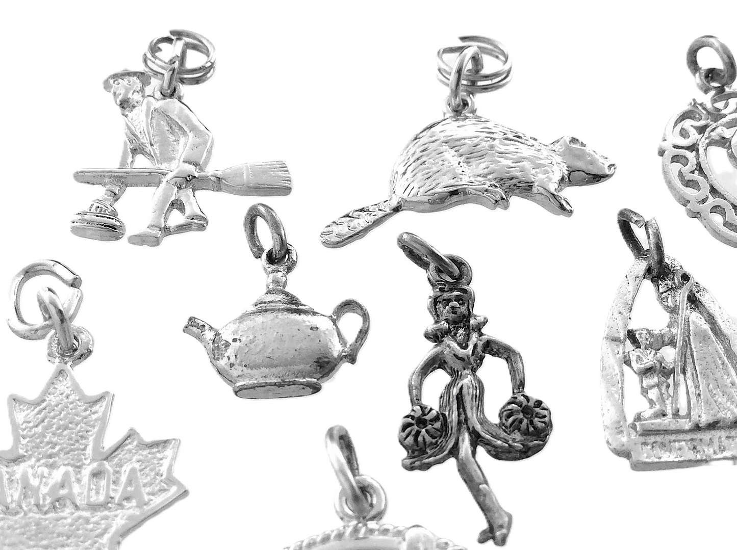 Lot of 12 Miscellaneous Pendant Charms Marked Ster 22.8 grams R591