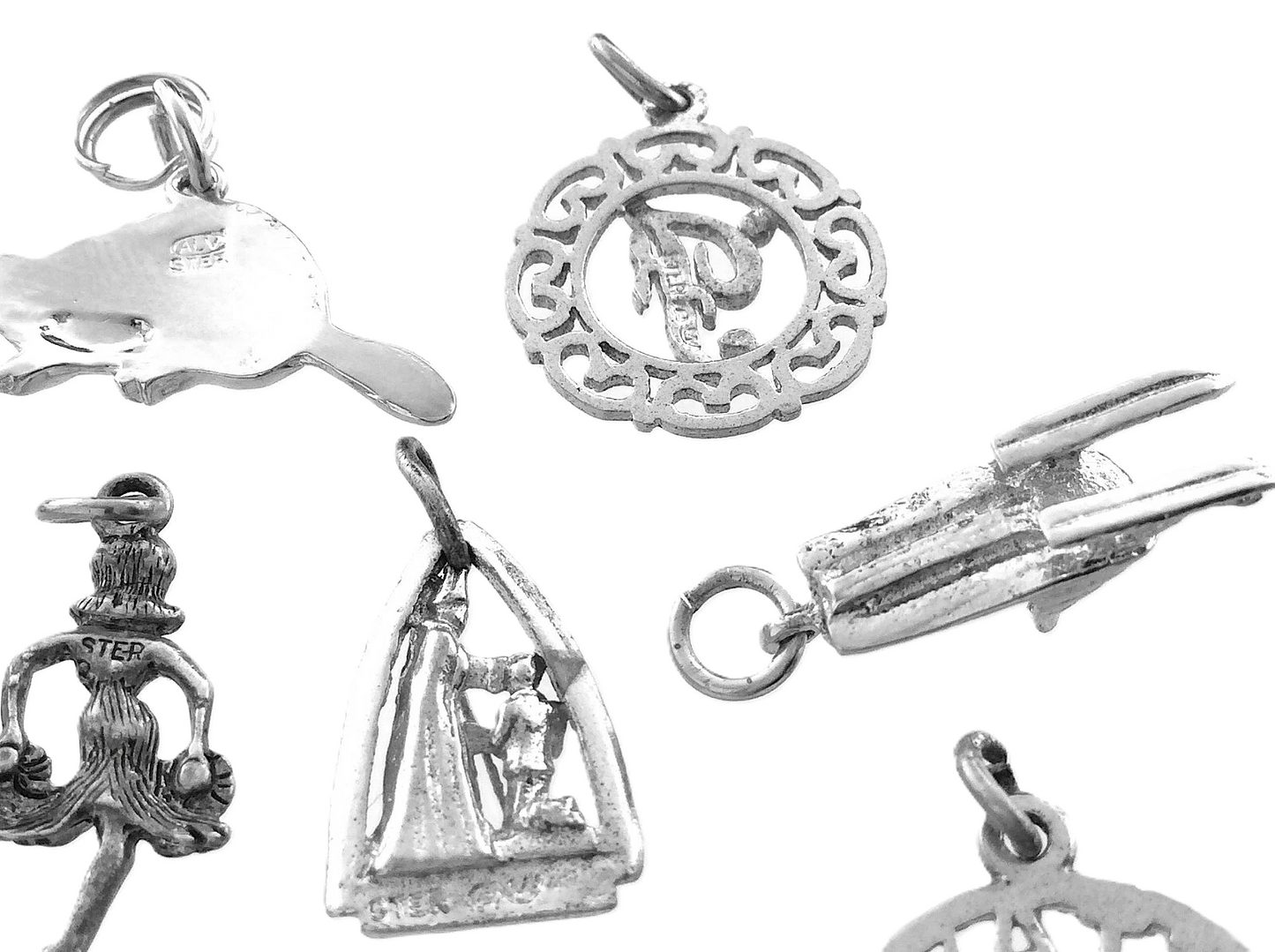 Lot of 12 Miscellaneous Pendant Charms Marked Ster 22.8 grams R591